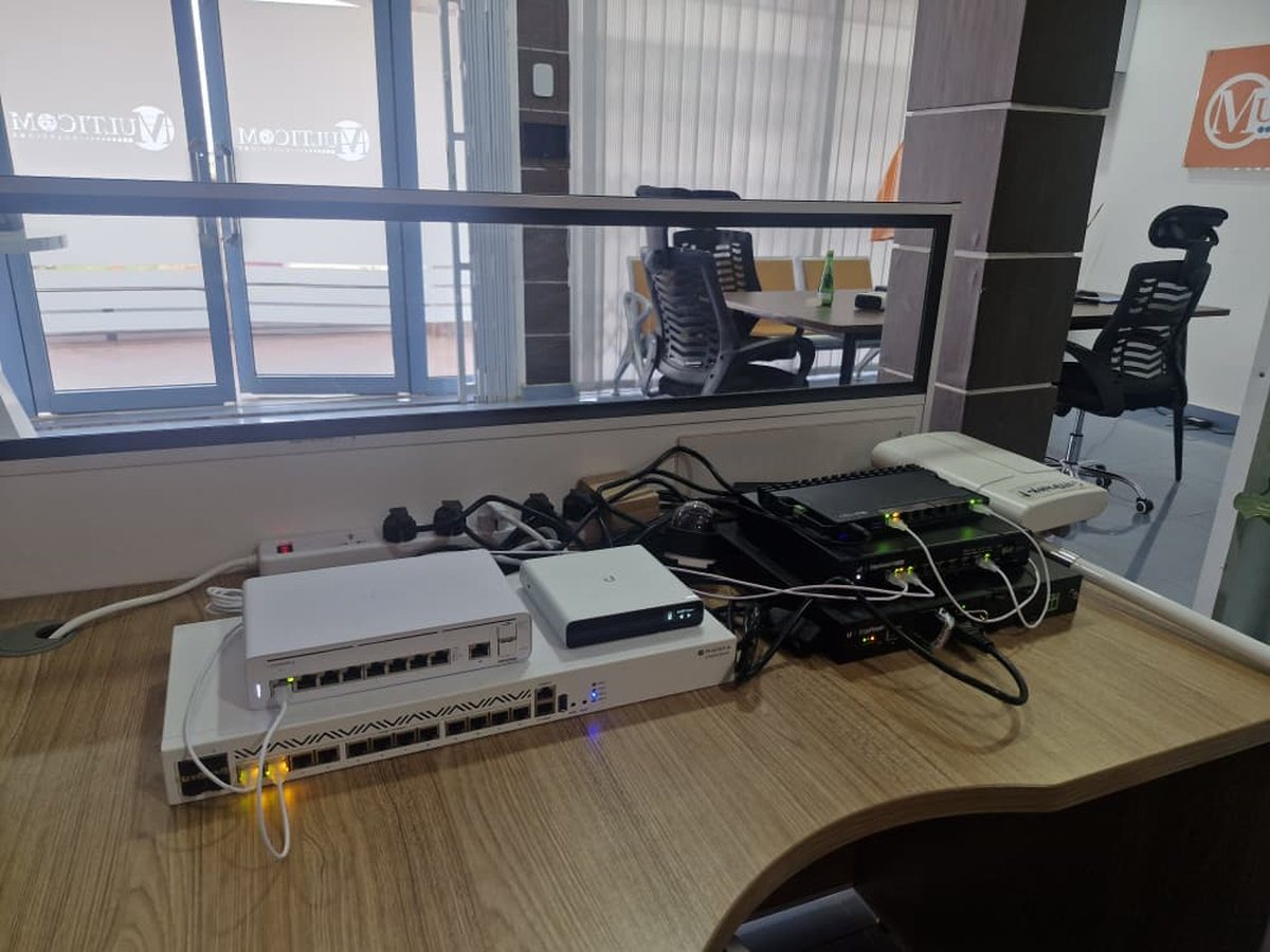 Switches, routers and radios staged on the bench in Accra