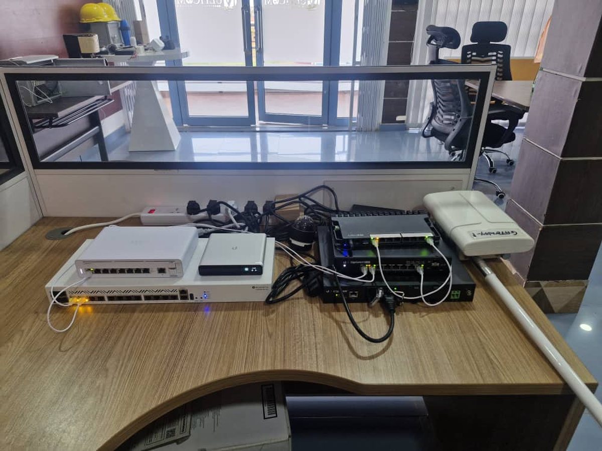 Switches, routers and radios staged on the bench before installation